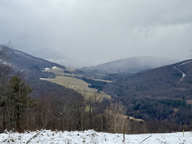 Sweeping views from the pipeline (snow curtain covering the mountains)