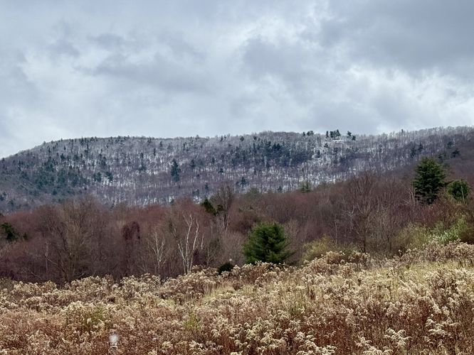 Snowy top of Miller Mountain as seen from the base