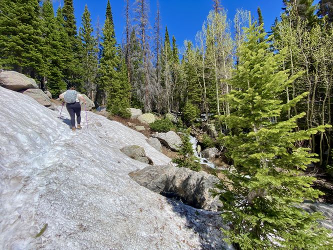 Hiking steeper snowfields along the Haiyaha Lake Trail
