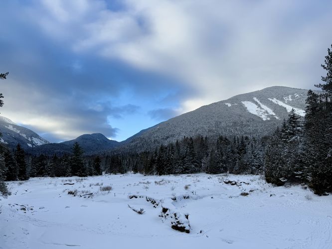 View of Wright Peak and its Angel Slides from Marcy Dam (east)