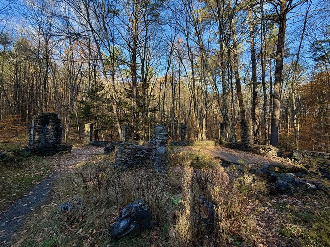 Walking into Madame Sherri's castle with fireplace and destroyed chimney in the center