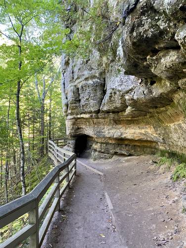 Trail leads along a cliffside to reach the 2nd overlook for Munising Falls