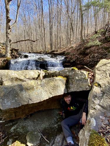 Dave in a rock cave at MyHikes Falls