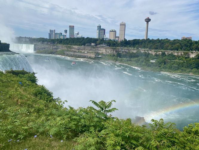 View of American Falls and Horseshoe Falls with a rainbow in Niagara Gorge