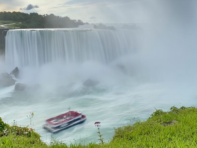 Boat at the base of Horseshoe Falls (long exposure)