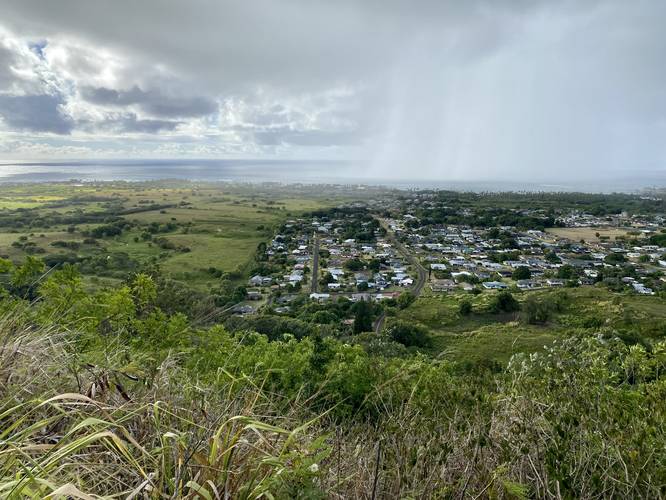 View of Wailua, HI (Kauai) with a rainstorm covering half of the photo