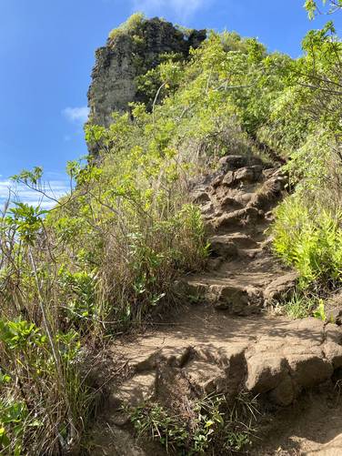 Steep rocky ledges lead up to the "Giant's Nose" atop Nounou (Sleeping Giant) mountain