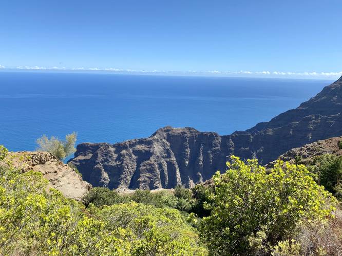 First view of steep mountain ridges along Na Pali coast after steep descent