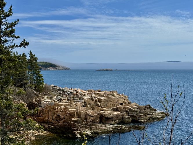 Views of the coastline, Great Head, Oak Soaker island, and Schoodic Head mountain behind ocean fog