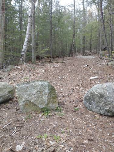 Large rocks block vehicles from accessing the old Railroad bed at Jaquith Road