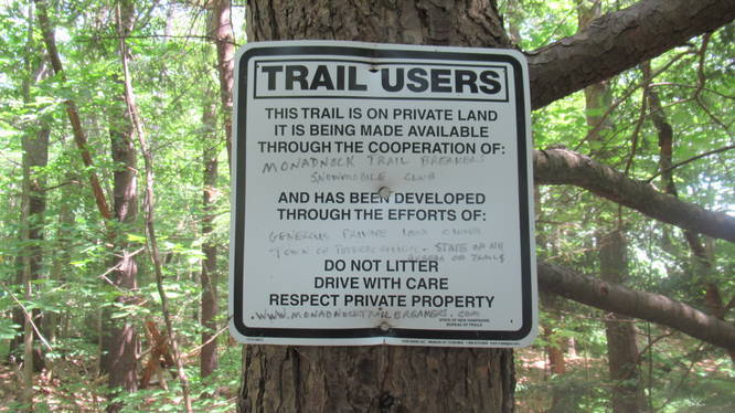 No trail blazes, but lots of other signs