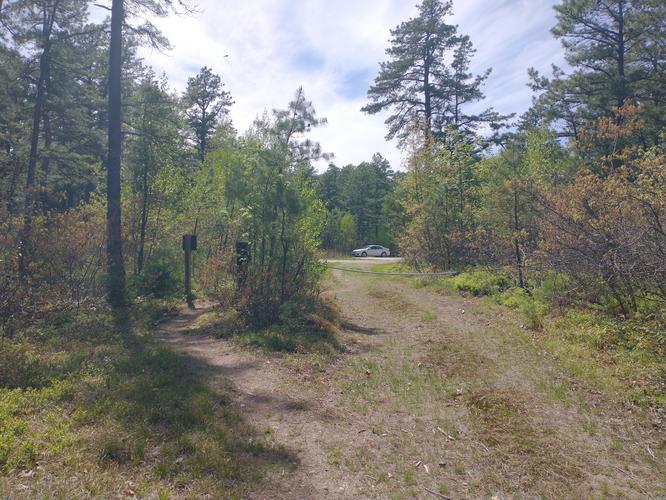 Gate at end of trail leading back to the parking lot.