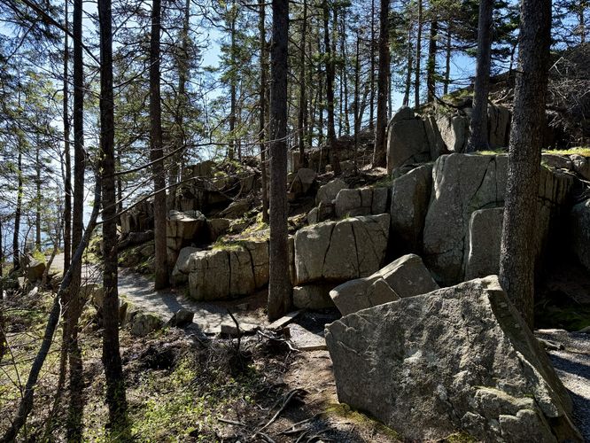 Large boulders sit along the Ocean Path