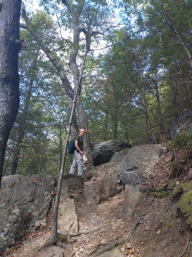 Back up the steep steps from the waterfall  and the trail has some rocky terrain