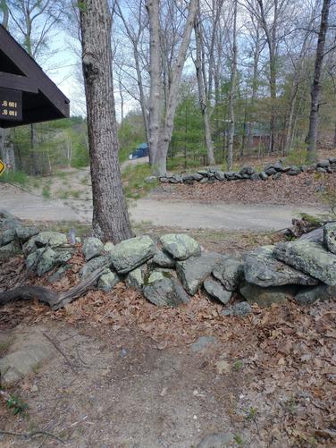 Over the stone wall to Round Pond Road 