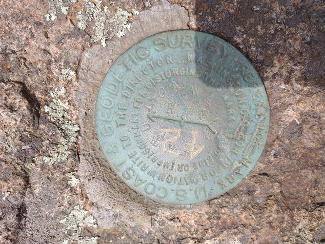 One of the 3 survey markers we found at the summit 