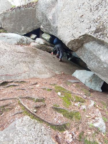 Exploring a cave at Devil's Den