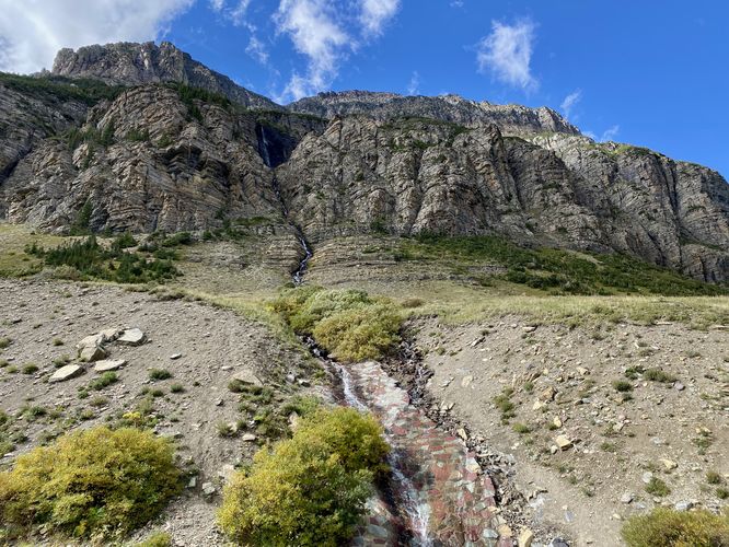 View of View of Piegan Falls in full with spillway to Going-to-the-Sun Road
