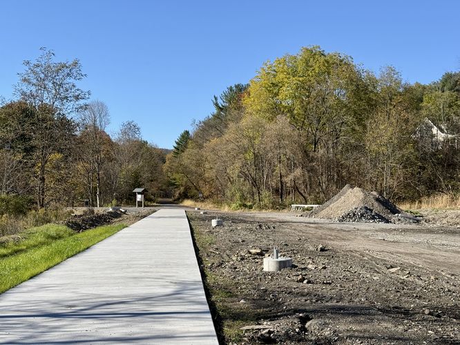 Paved trail leads to the crushed gravel path of the Wellsboro Extension