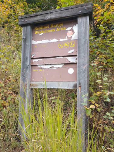 Trail sign in need of repair