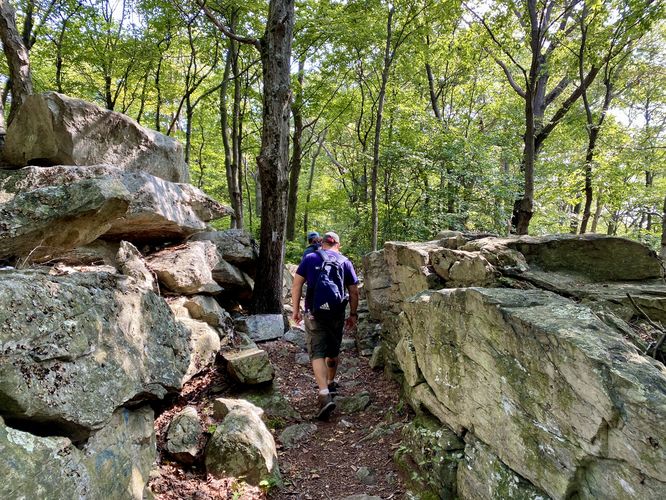 Hiking between rock ledges en route to The Pinnacle