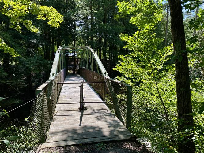 Footbridge crosses the Rexford Falls Brook