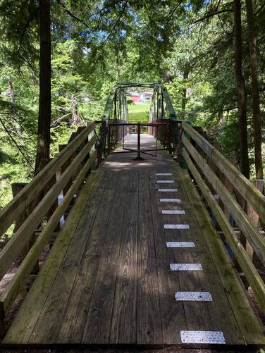 Footbridge crosses the Rexford Falls Brook