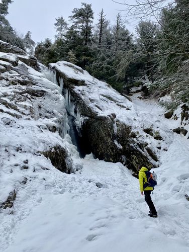 At the base of Roaring Brook Falls