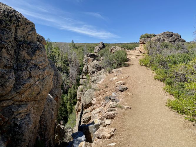 Trail runs along steep rock ledges