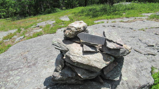 Trail sign and cairn