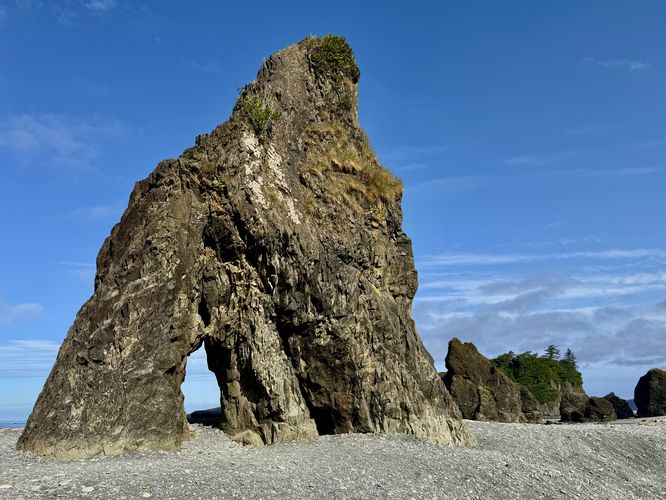 Sea stack with a hole in it