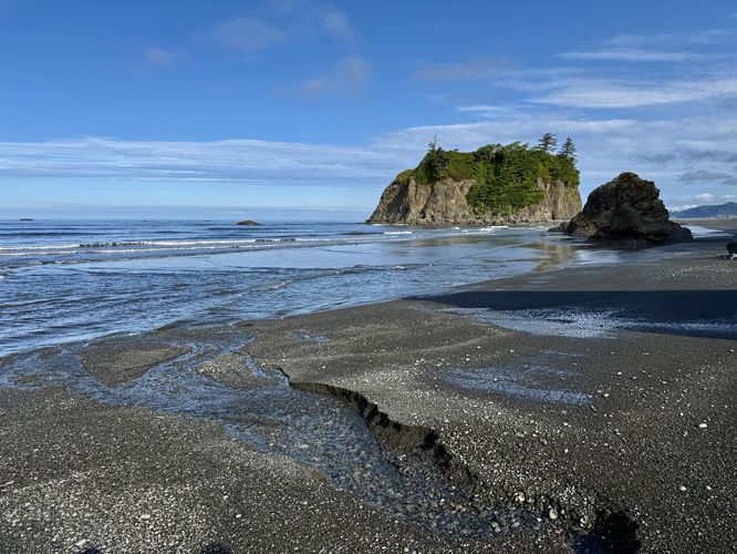 Water seeps through the sand at Ruby Beach from underground streams