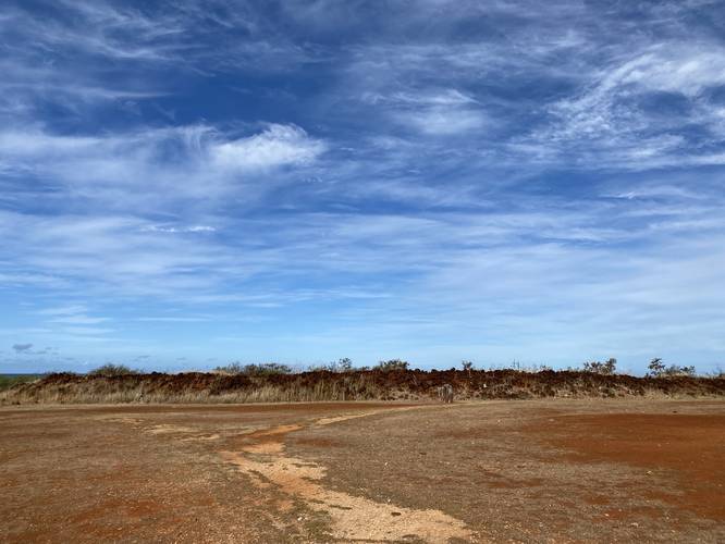 Trail heads towards the lava rock wall of Russian Fort Elizabeth