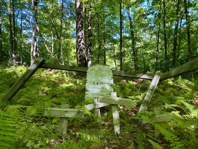 Silly "grave sites" with tombstone inscribed "Those who resort to extorsion end up here"