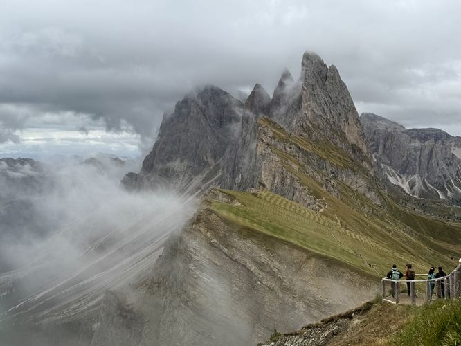 Hikers stand in awe of the picturesque Seceda Ridge