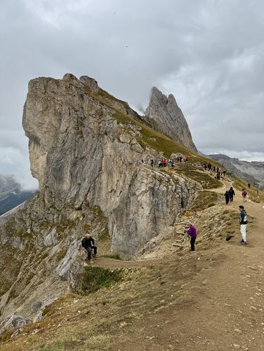 Tourists line up for photos on Seceda Ridge