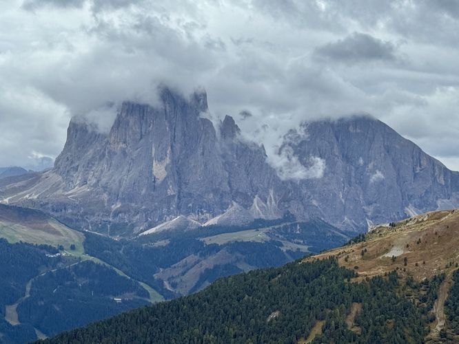 View of clouds covering the peaks of the Langkofel Group massif