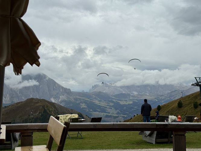 Paragliders swoop down from Seceda Ridge