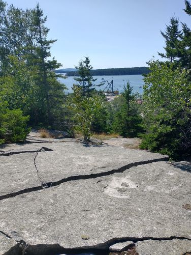 Use caution while exploring to avoid  trip hazards such as fissures or crevices in the rock face