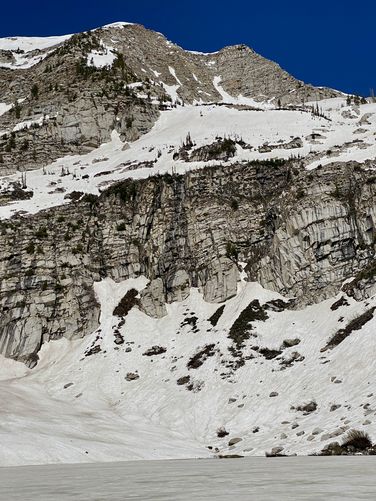 Waterfall of snowmelt flows into Silver Lake from the peaks above