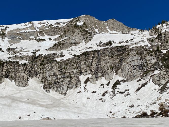 Waterfall of snowmelt flows into Silver Lake from the peaks above