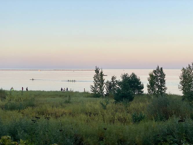 View of Lake Superior at sunet (rowers on the water)