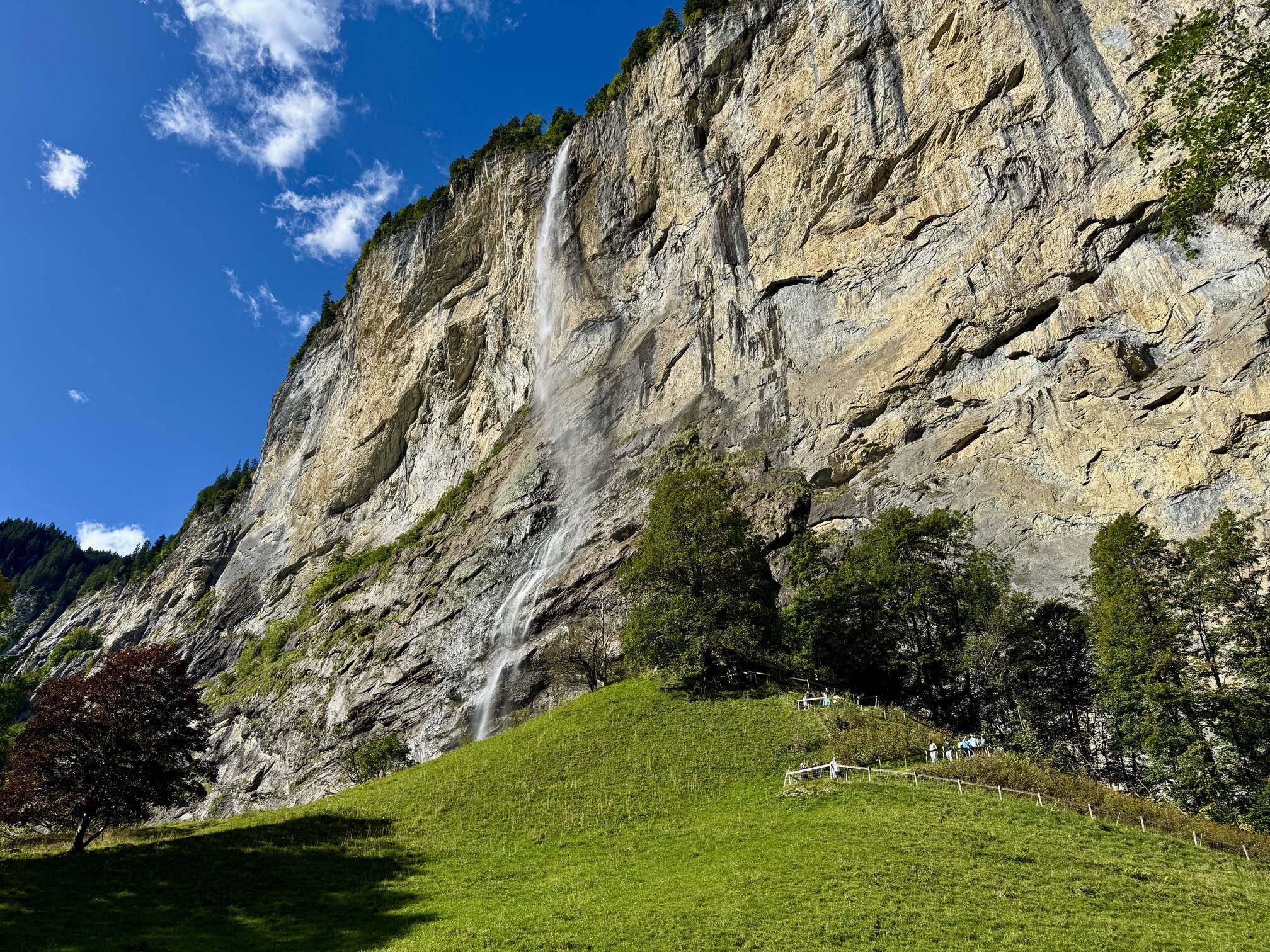 The 297 meter tall Staubbach Falls plumments over a cliff into an alpine valley in Lauterbrunnen, Switzerland.