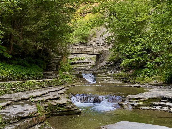 Small waterfalls and a wooden footbridge