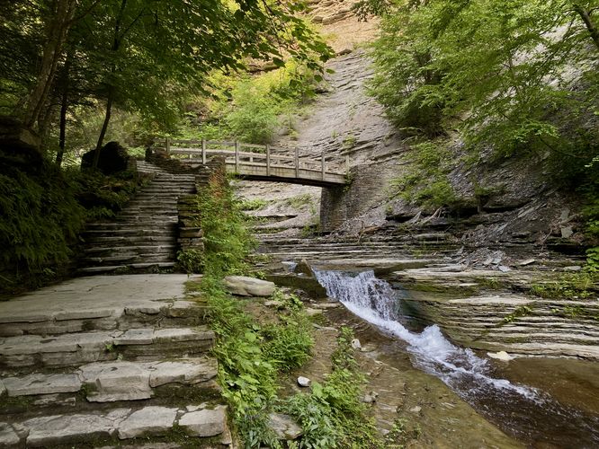 3-foot tall waterfall and a wooden footbridge