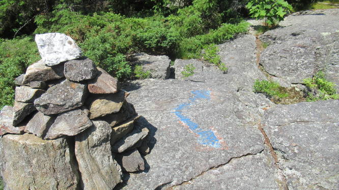 Rock Cairn and painted trail marker