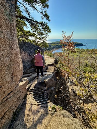 Metal grate spans a cliff gap on The Beehive Trail