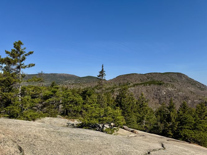 View of Cadillac Mountain (left), Dorr Mountain (cener), and Champlain Moutain (right) from The Beehive summit
