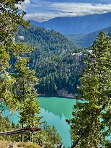 A view of Diablo Lakes turquoise waters with the Diablo Lake Overlook located across the way