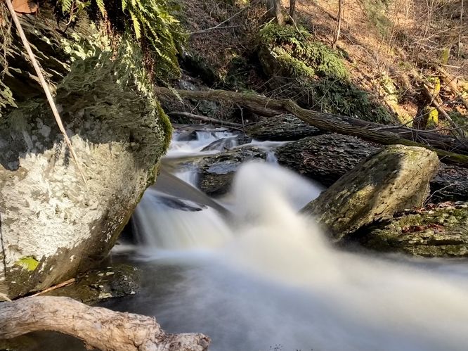  Interesting display of water as it splits on a rock below a small cascade (long exposure)